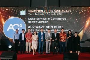 Award ceremaony with AC2 team on stage holding trophies. Background displays "Champion of the Digital Age", wining another award "Silver Award" in eCommerce category.