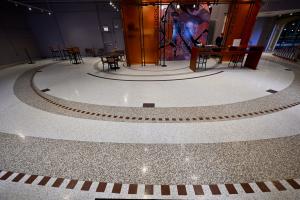 terrazzo floor with overlapping orbits in terrazzo with brass divider strips