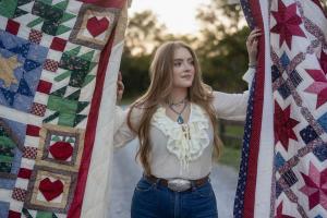Singer SJ McDonald  wrote a song titled "The Quilt" and made a video of her singing it The National Quilt Museum