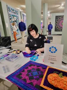 Live quilting demonstration stations are free with admission at The National Quilting Museum on National Quilting Day, March 21, 2026
