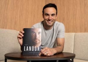Landon Donovan with Book