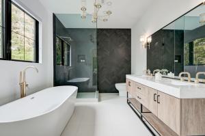 Grand Building Construction, a fully licensed and insured home remodeling contractor based in Renton, Washington, is proud to announce the expansion of its comprehensive home renovation services to more than 80 cities across the greater Seattle metropolitan area Luxurious bathroom remodel by Grand Building Construction featuring custom vanity, walk-in shower, and premium tile finishes in Renton WA
