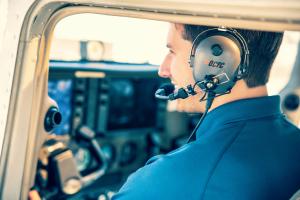 With more than four decades of operation at John Wayne Airport, Orange County Flight Center (OCFC) is a Federal Aviation Administration-approved Part 141 flight school offering structured, syllabus-based pilot training Student pilot flying a training aircraft during a lesson with Orange County Flight Center at John Wayne Airport under a Part 141 training program.