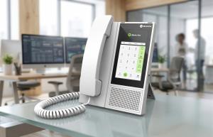 E-MetroTel, a global provider of secure enterprise communications solutions, today announced the upcoming release of the Infinity 7005D Digital Smart Desk Phone, a next-generation multi-touch digital phone developed as part of its ongoing Green Migration product strategy E-MetroTel Infinity 7005D digital smart desk phone on a modern office desk, featuring a touchscreen interface and handset, designed for enterprise communications
