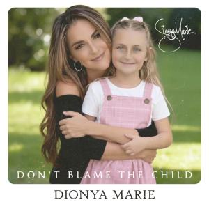 Singer-songwriter Dionya (pronounced Dee-on-ya) Marie follows up on her recent radio hit, “Miss You So Mad,” with her most emotionally impactful release to date, “Don’t Blame The Child Picture of Dionya Marie hugging child in front of her