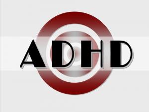 image of a logo, circle with the letters in all caps in black ADHD