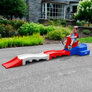 Simplay3 Celebrates American Manufacturing with Limited Edition Series 13 A young child playing on a red, white, and blue miniature rollercoaster.