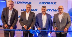 Dymax employees and the Lord Mayor of Wiesbaden, Germany cut the blue ribbon at the opening of the new Dymax Europe facility