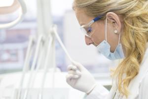 Semi-close-up of a female nurse at YouShine Medspa, wearing professional attire, representing expert aesthetic care and patient-focused service.
