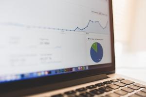 Close-up of a laptop displaying analytics and charts, representing a data-driven digital marketing approach for healthcare growth.