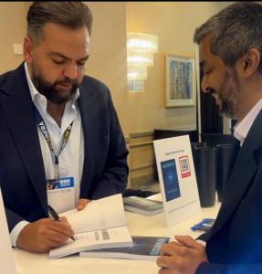 Amjad Jaber takes time to connect one-on-one, signing books and discussing leadership at P3C 2026.