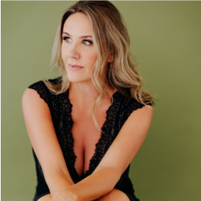 Headshot of Michaela Renee Johnson, Ph.D., author of "7 Primal Wounds: Break the Patterns Keeping You Stuck."