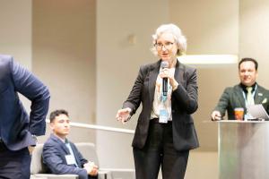 Dr. Morgan demonstrates the Immersion-to-Impact model in action, facilitating direct engagement between academic leadership and industry practitioners.