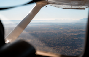 Aerial perspective of Northern Arizona desert terrain viewed from a small aircraft.