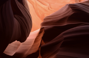 Curved sandstone walls in Antelope Canyon shaped by erosion over time.