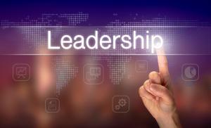 photo of a logo with soft multi color background with large letters upfront that say leadership