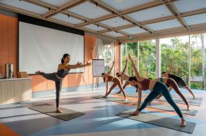 Refresh your body and mind with a guided yoga session surrounded by tropical greenery at The Summer Social.