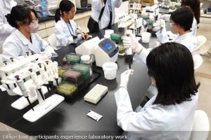 Office tour participants experience laboratory work.