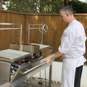 Chef cooking with Argentine Grill XL