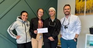 Twin Peaks Family & Cosmetic Dentistry, a leading dental practice in Longmont, is proud to announce the continued success of its annual Dr. McKay Butler, family and cosmetic dentist in Longmont, CO, presenting a check to LEVI