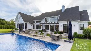 Custom Island Homes Classic Hamptons-Style Residence with Resort-Style Backyard
