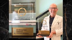 Dr. Michael Sohl Displaying His Awards
