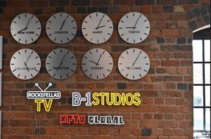Rockefellas TV B1 Studios and XPTV Global wall branding inside the Birmingham UK studio