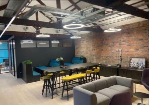 Modern creative lounge at B1 Studios Birmingham with exposed brick seating and production workspace