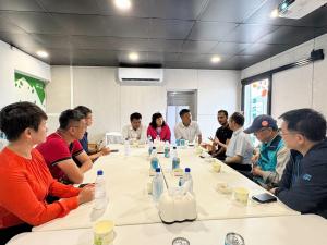 UN officials and local stakeholders discussing blue carbon at traditional salt fields in Beimen, Taiwan, during a site visit.