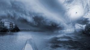 A collage of hurricane hazards. Palm trees bend in the extreme wind, storm surge floods the coast as torrential rain causes inland flooding. The storm spawns tornadoes and power outages darken entire regions.