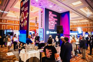 A photo of Influx Marketing's booth at the 2026 Medical Spa Show in Las Vegas, announcing the release of Growthstack, a new all-in-one growth platform built for medspas.