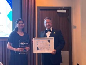 Dr. Ira Saxena Accepts Award