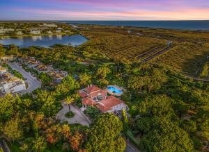 A distinguished frontline villa overlooking the protected Ria Formosa National Park––one of the most coveted locations in Quinta do Lago resort, voted World's Best Golf Real Estate Venue