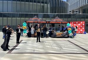 YWCA Greater Los Angeles booth featuring mariachi musicians at the inaugural Denim Day rally on April 29, 2026, in Long Beach, CA.