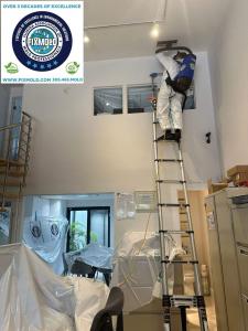 Fix Mold technician using professional mold testing and mold abatement equipment inside a Fort Lauderdale property.