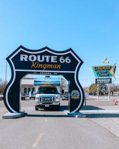 In celebration of the 100th anniversary of Route 66, the 10th anniversary of L Cruise America RV in Kingman, AZ, under a big Route 66 sign in the road.
