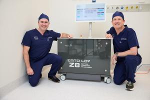 Australian first: Brisbane corneal surgeons Dr David Gunn and Dr Brendan Cronin offer customised femtosecond CAIRS for keratoconus Dr David Gunn and Dr Brendan Cronin crouching next to two Ziemer Z8 femtosecond laser
