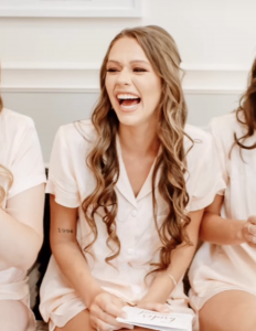 Farrah Mechael Releases 'Raindrops,' a Cinematic Tribute Honoring Life and Transforming Grief Into Healing 18 Young woman smiling and laughing indoors in a candid moment.