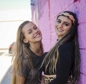 Farrah Mechael Releases 'Raindrops,' a Cinematic Tribute Honoring Life and Transforming Grief Into Healing 19 Two young women smiling together in a close friendship moment.