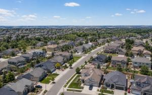 Aerial view of an American suburban neighborhood showing single family homes representing the national housing affordability challenge in 2026