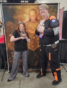 Jacob Bartlett, a member of Circle City Ghostbusters, attended PurrCon at PopCon in Indianapolis last year with the intention of taking a Ghostbusters II-themed photo with one of the kittens on the convention floor Ghostbuster in costume holds white kitten Marshmallow at PurrCon inside Indianapolis PopCon convention
