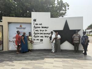 Group of people in front of a monument