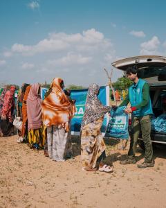 l Mustafa Welfare Trust Qurbani 2026 meat distribution on the ground in Africa, field team handing Qurbani donation packages to women and families on Eid al-Adha