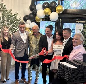The Grille on Congress, a beloved neighborhood dining destination serving the community since 1999, is proud to announce its grand reopening Restaurant owners and management gather for the ribbon cutting at the grand reopening of The Grille on Congress in Boca Raton, Florida.