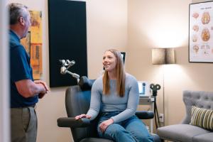 Dr. Brian S. Earthman speaks with patient
