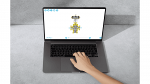Top-down view of a laptop displaying an interactive 3D cutaway model of an industrial control valve on the saVRee learning platform.