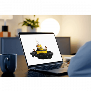 Person using a laptop to view an interactive 3D model of a yellow and black tugboat on the saVRee learning platform.