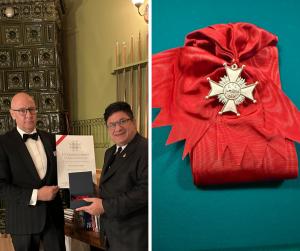 Major General Karl Engelbrektson, Grand Master of the Order of Innocence, presents Stephen Shaya, M.D., with the Order of Innocence (5th Grade) in recognition of his humanitarian service as Chief Hospitaller.
