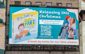 Times Square billboard featuring the children’s book It’s Just a Fart during Kimberly Spencer’s visibility marketing campaign exploring trust, storytelling, and modern media strategy.