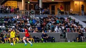 United City FC Women player driving the ball in front of home fans at Championship Stadium (Irvine, CA).